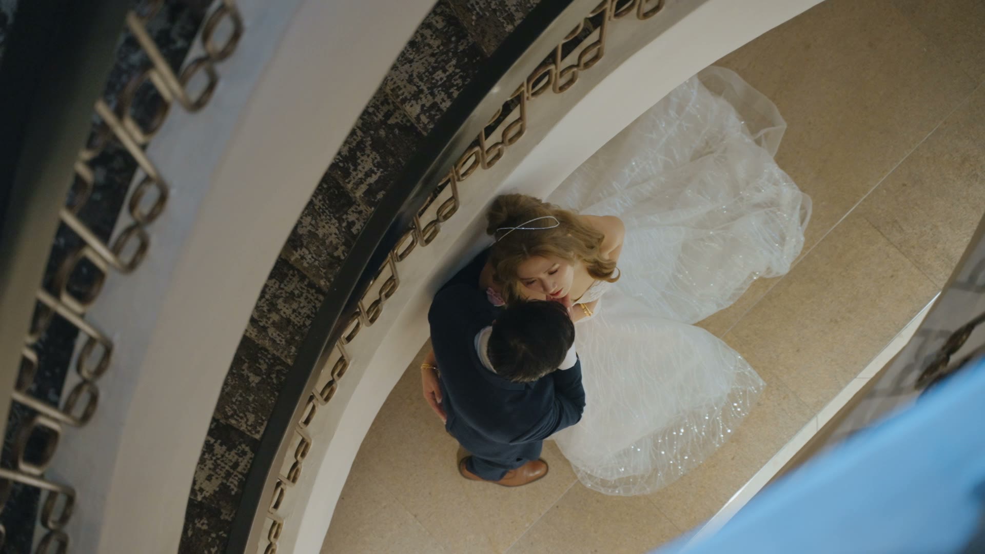 An overhead view of a couple embracing on their wedding day